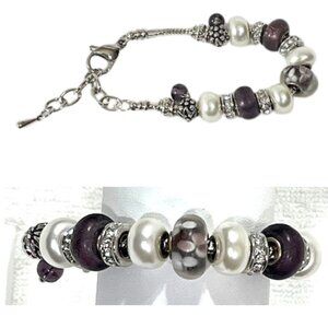 Silver and purple charm bracelet.